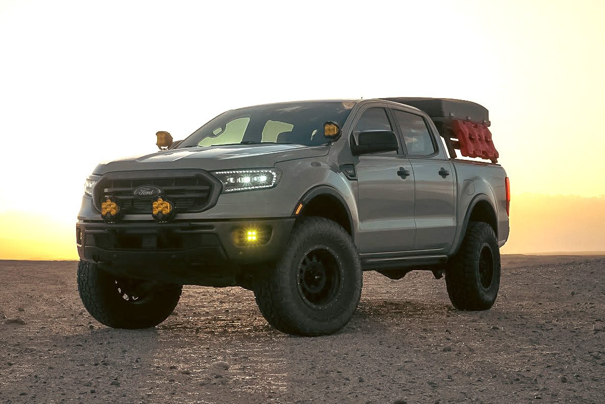 Grey Ford Ranger at sunset with Baja Designs lights in the desert